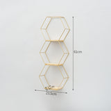 Simple geometric wire frame wall shelves.